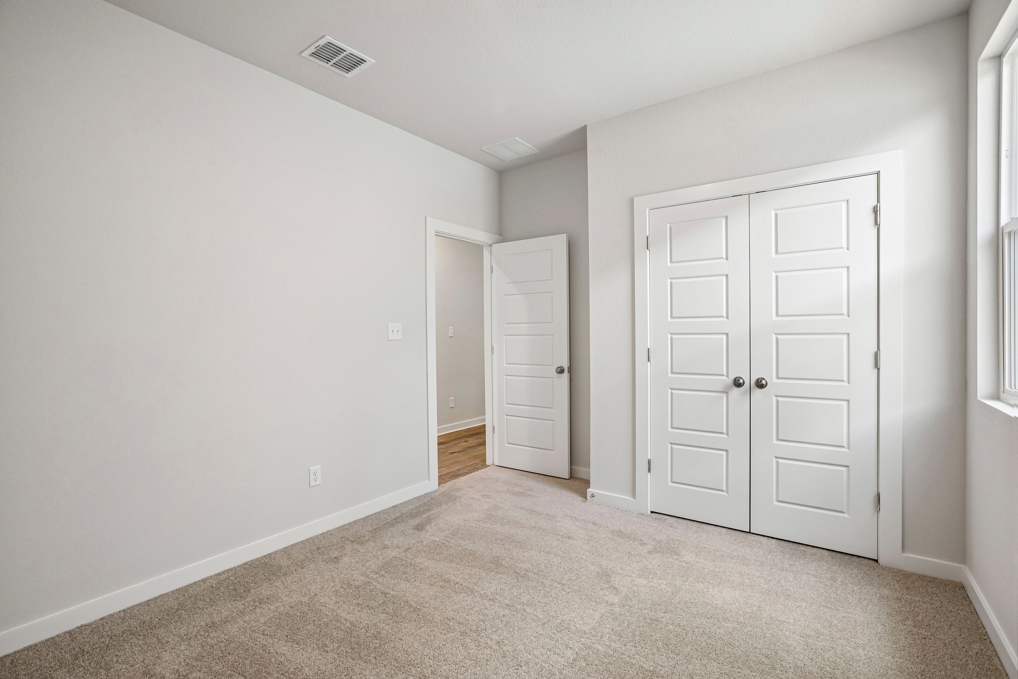 A room with white doors.
