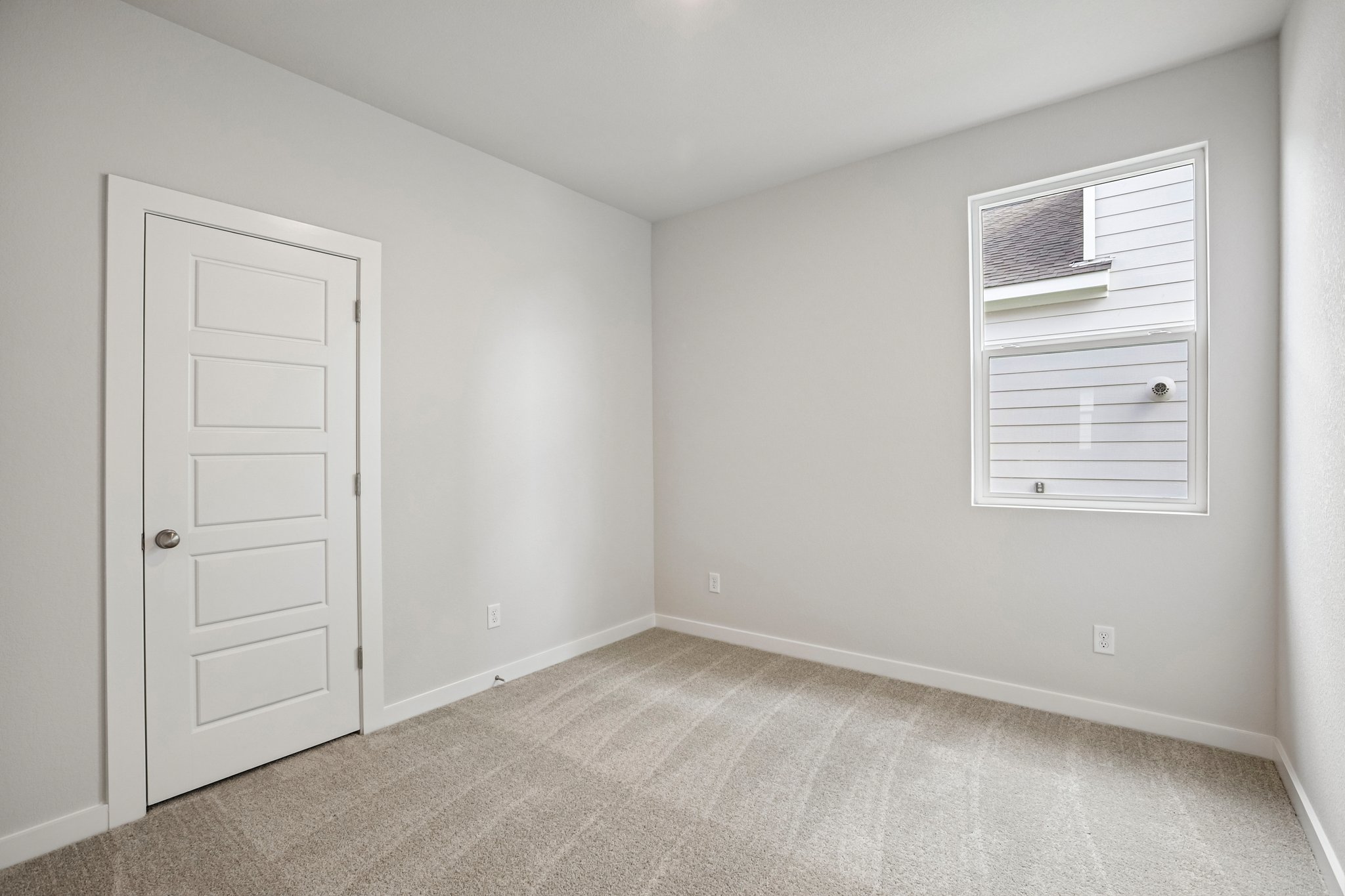 A room with a door and a window.