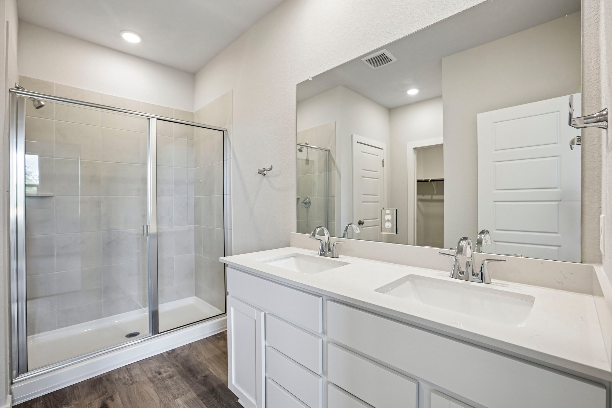 A bathroom with a glass shower.