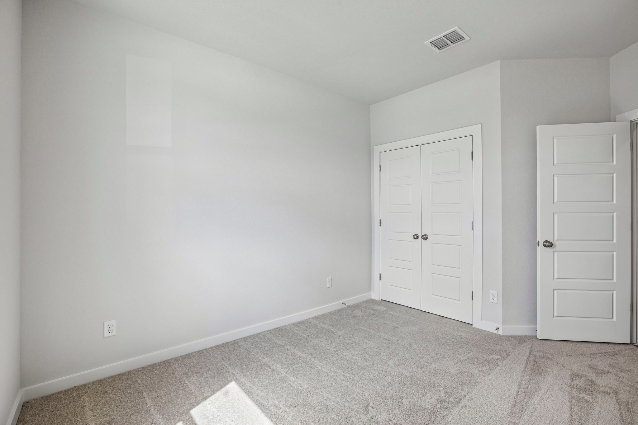 A room with white doors.