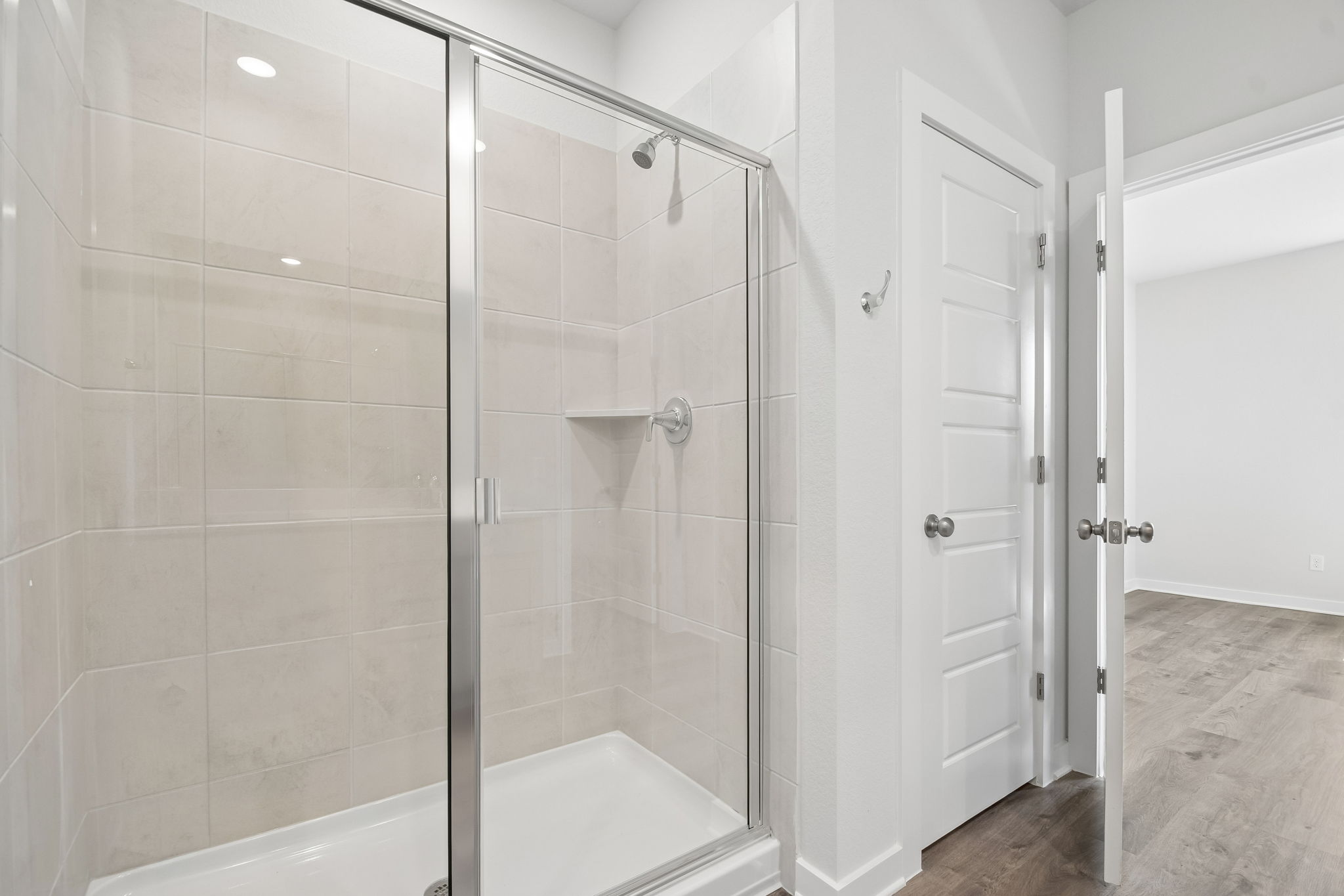 A bathroom with a glass shower.