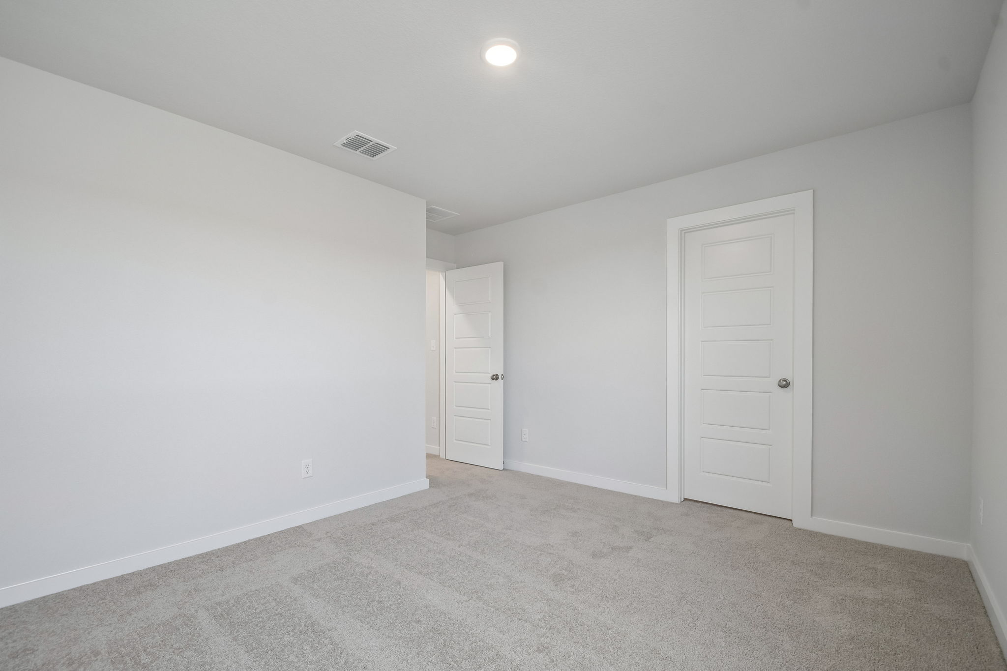 A room with white doors.