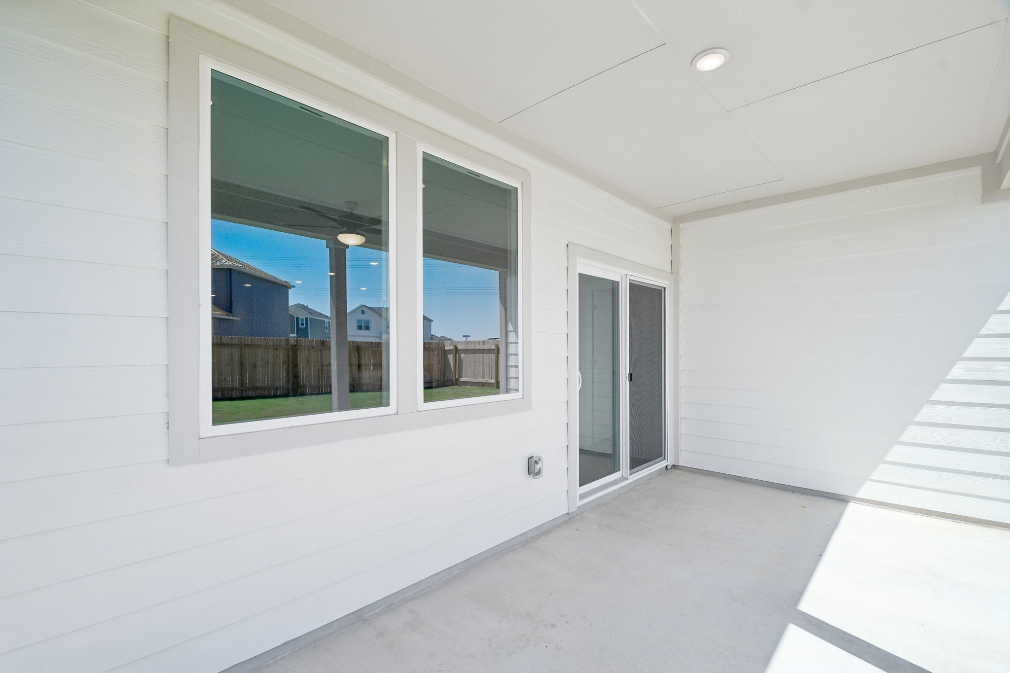 A white room with a window.