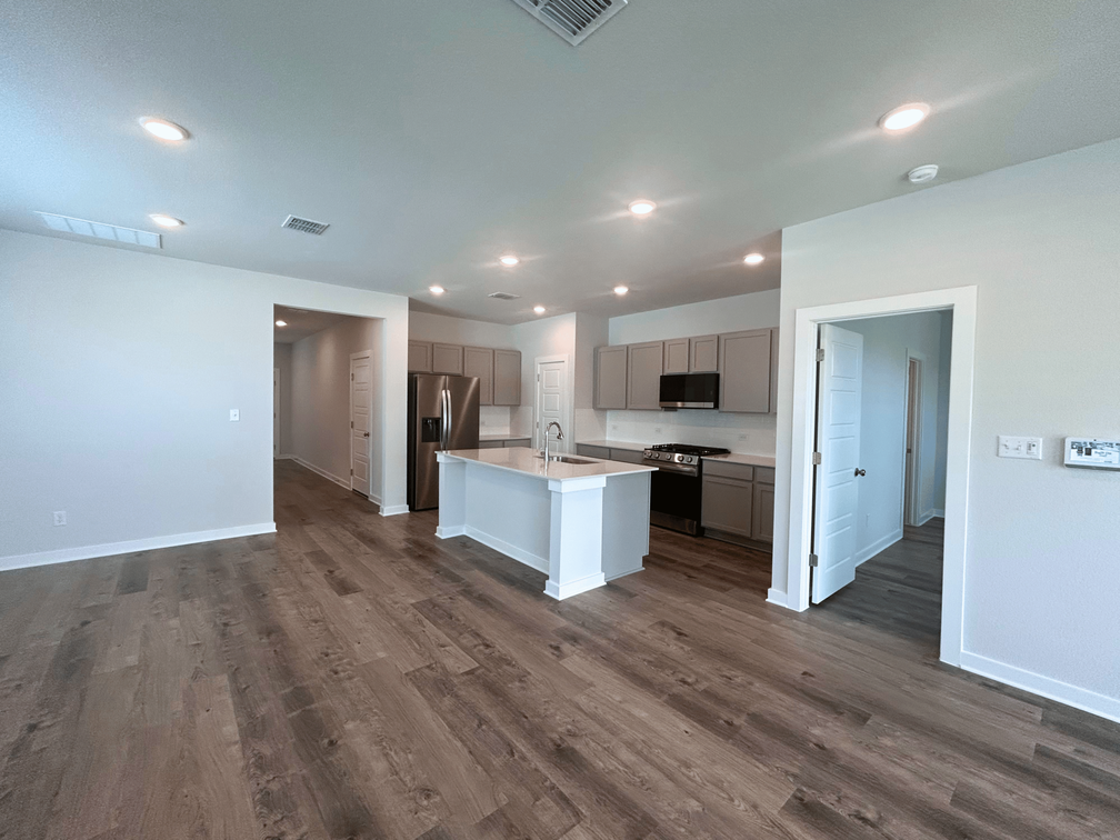 A kitchen with white walls.
