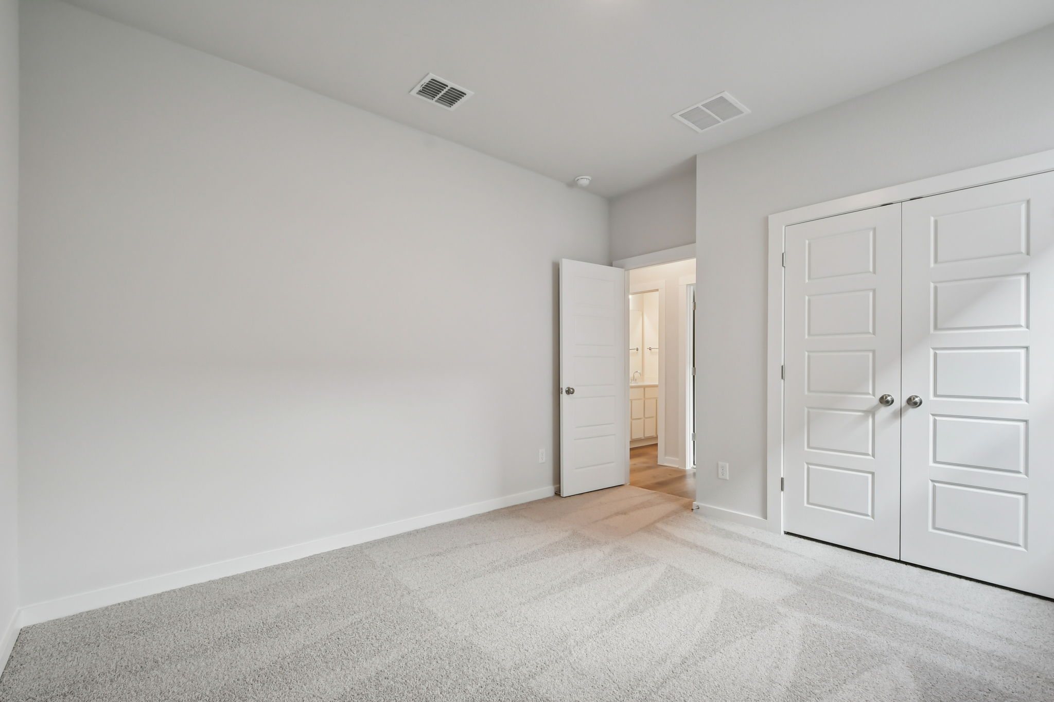 A room with white doors.