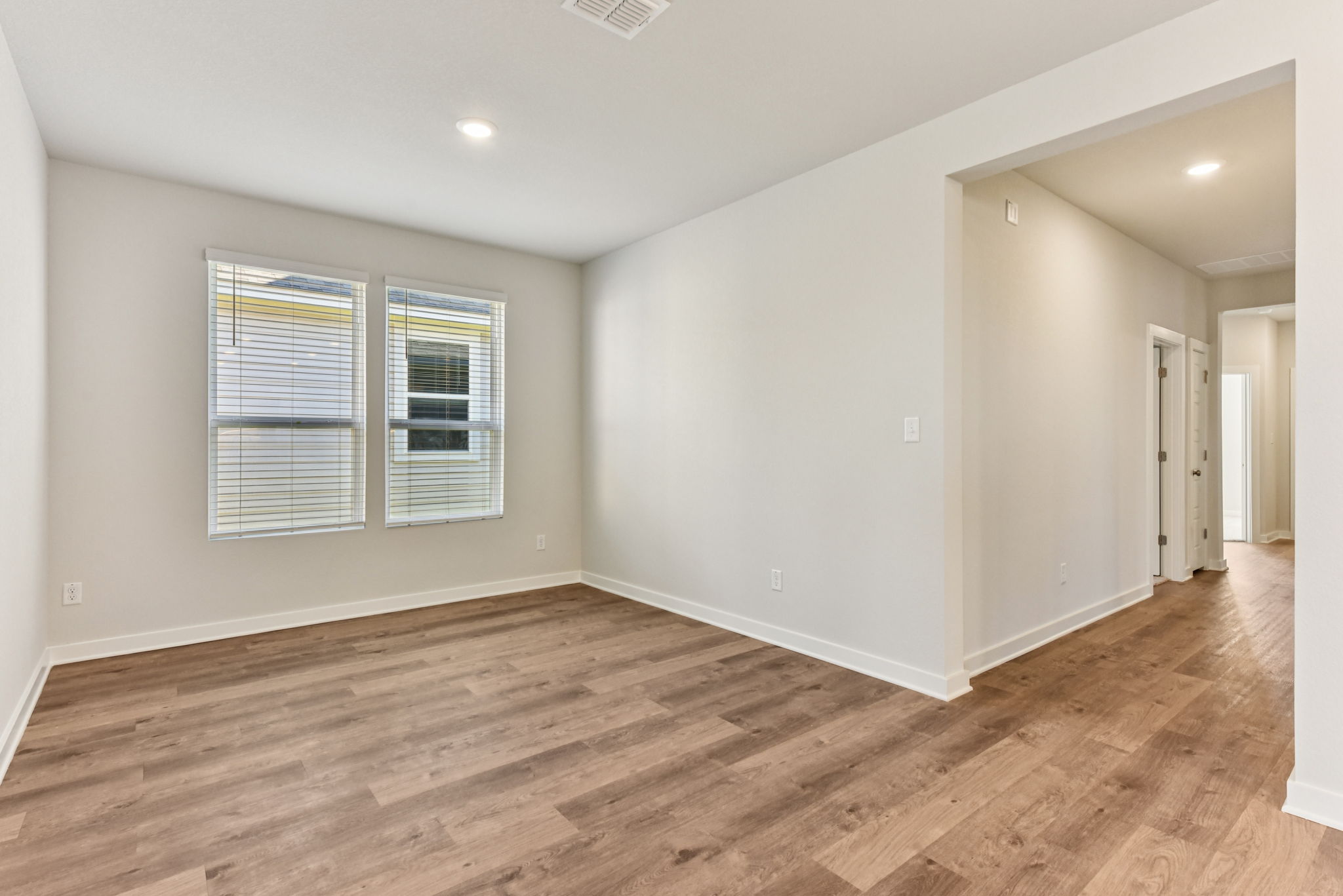 A room with a wood floor and a wood floor.
