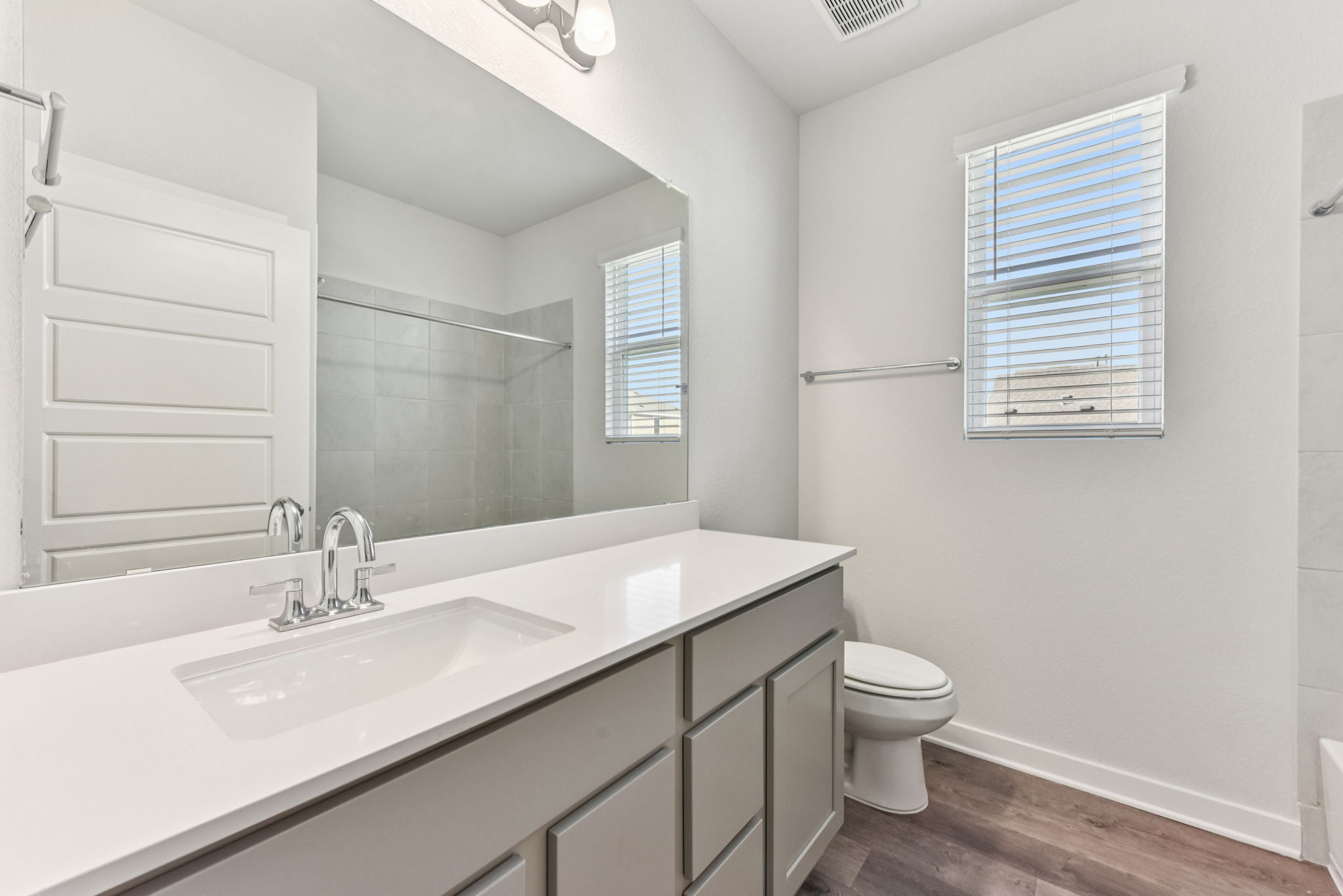 A bathroom with a sink and a toilet.