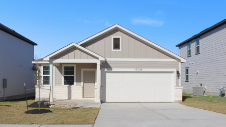 A white house with garages.