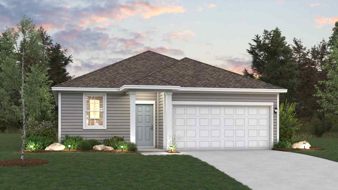 A house with a garage and a lawn in front of it.
