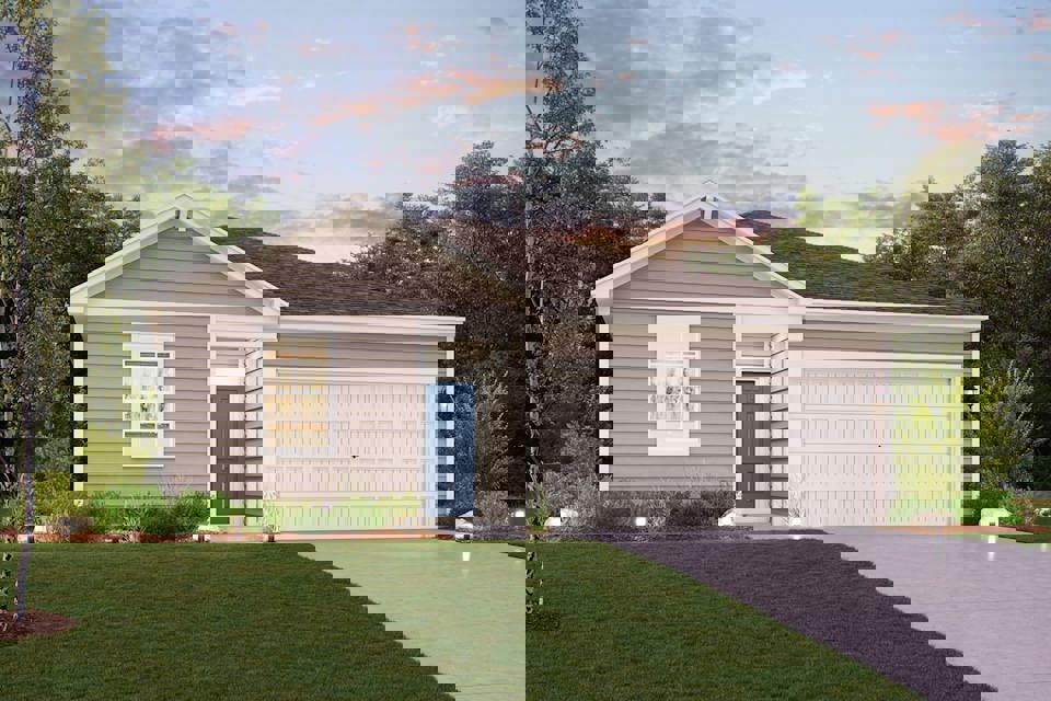 A house with a lawn and a pond in the front.