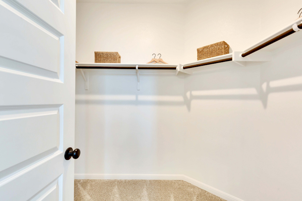 A white wall with a basket and a basket on it.