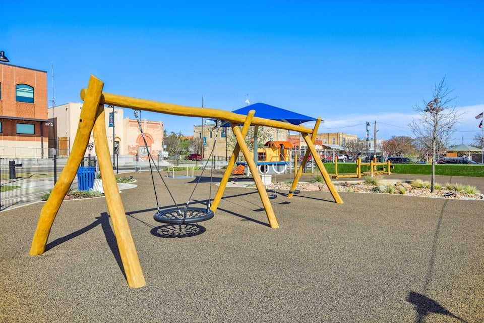 A playground with yellow slide.