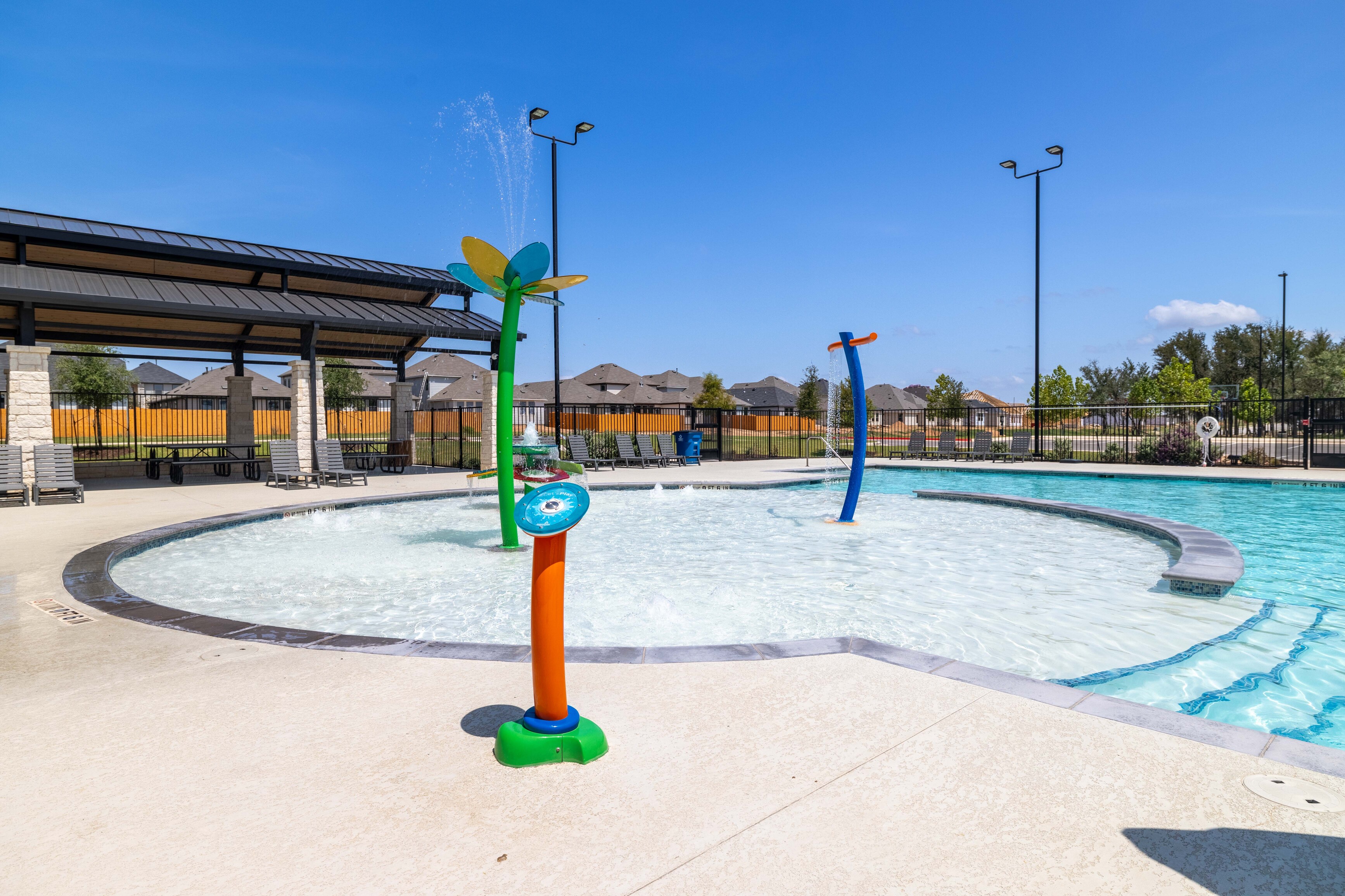 A pool with a slide in it.