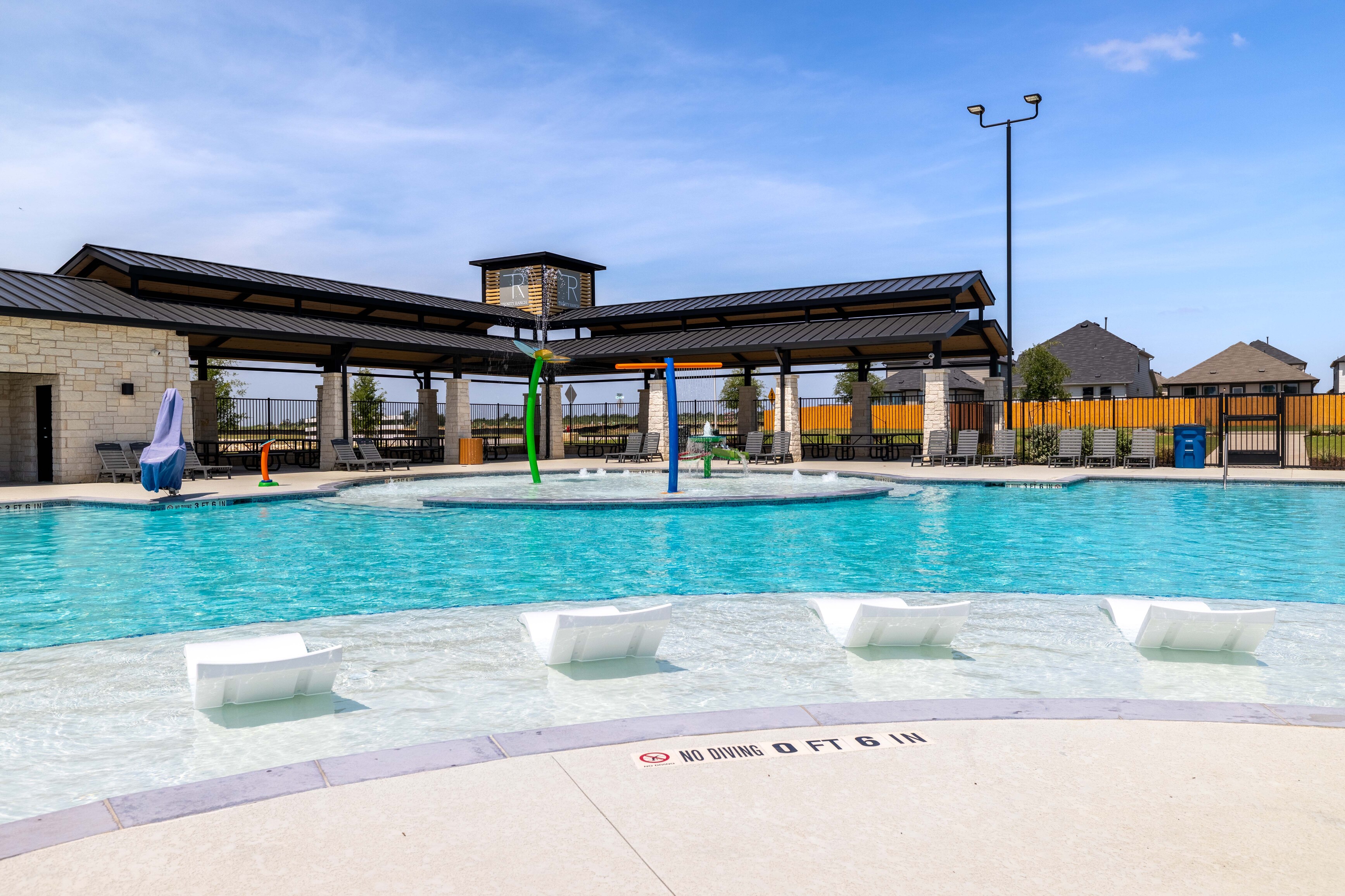 A swimming pool with a covered area.
