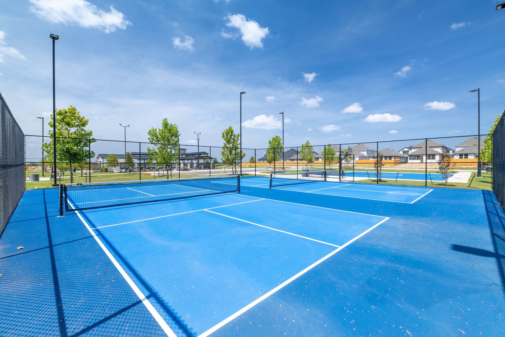 A tennis court with a net.