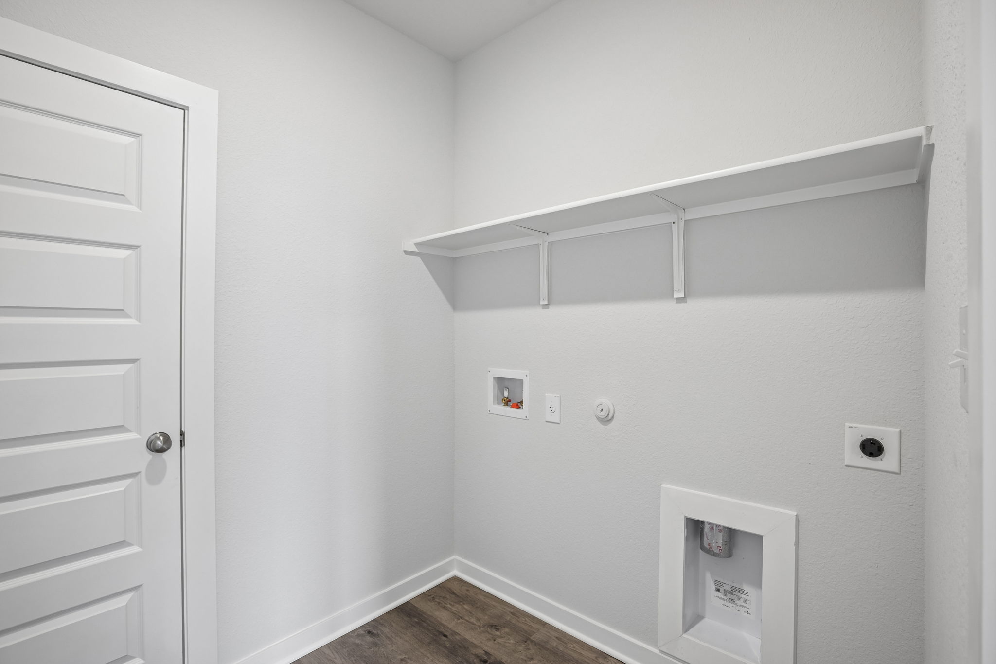 A white wall with a white door and a white door.