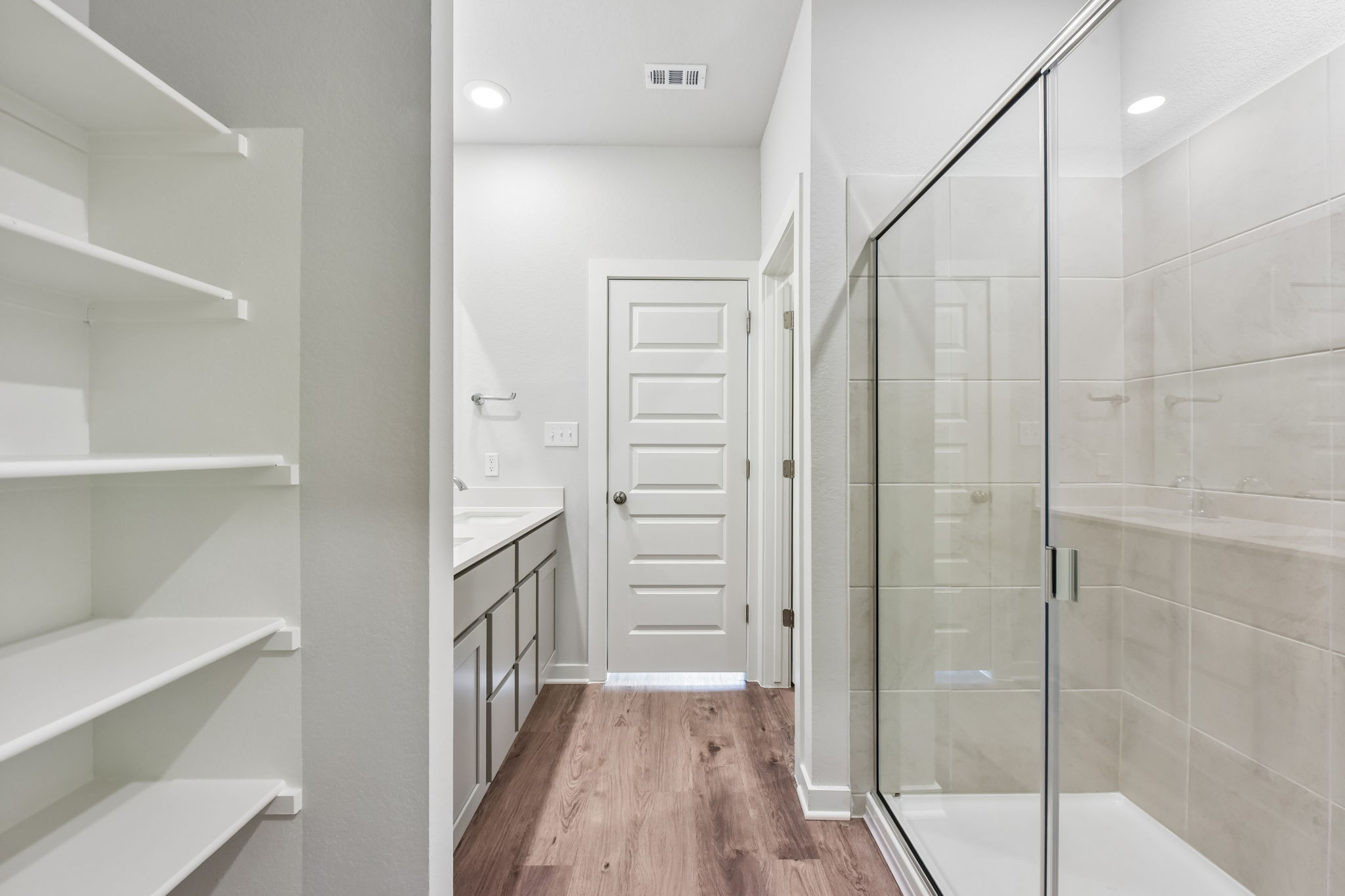 A bathroom with a glass shower.
