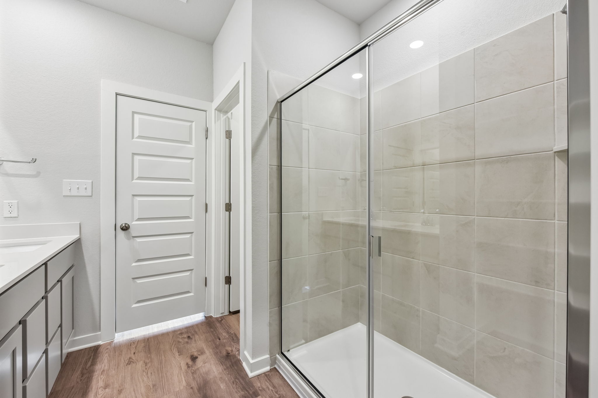 A bathroom with a glass shower.