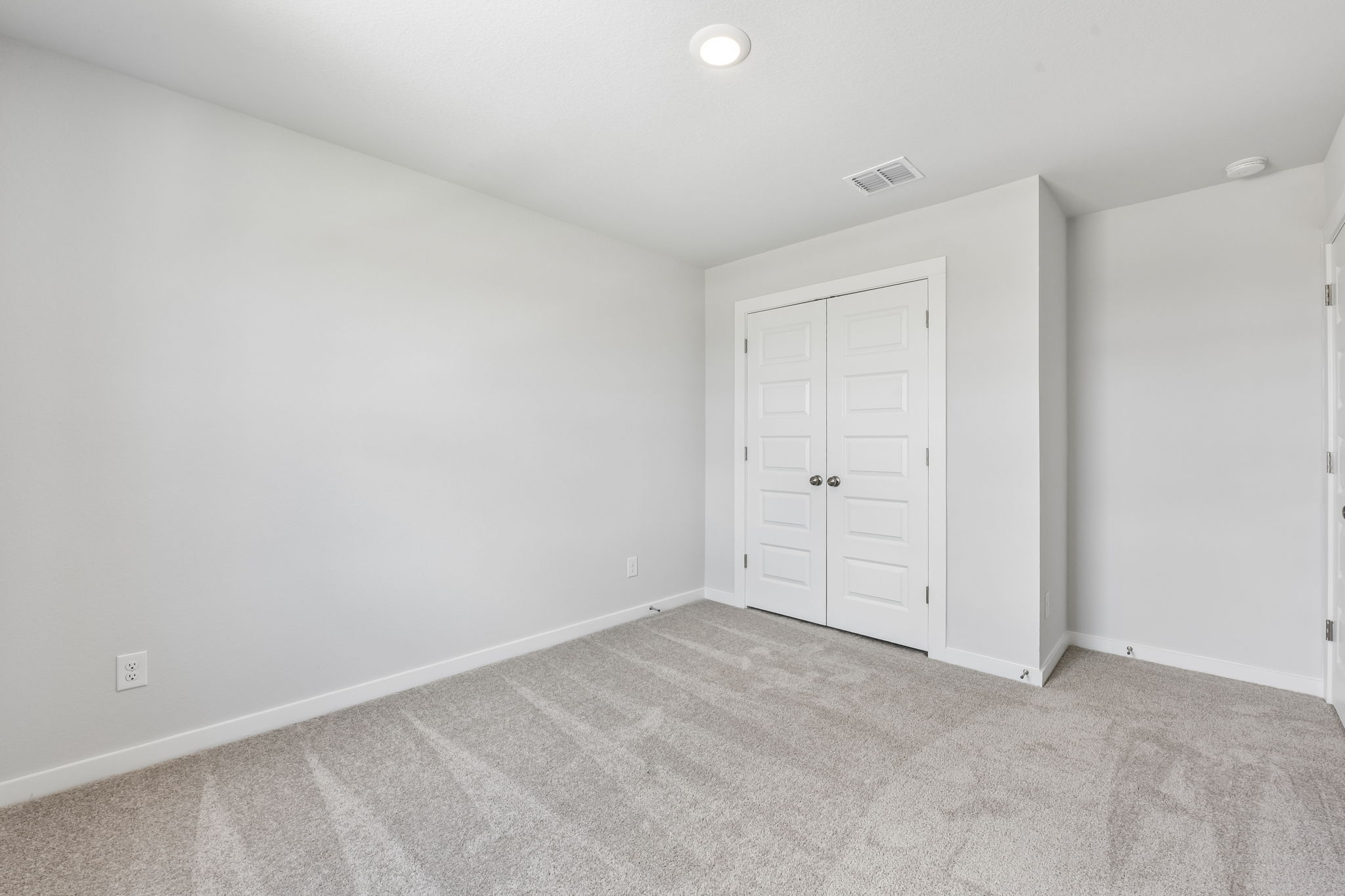 A room with white doors.