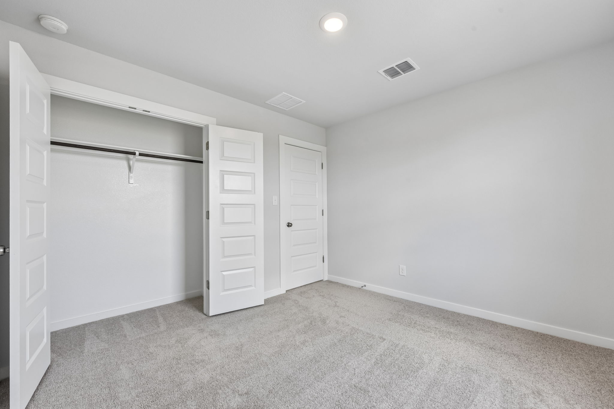 A room with white cabinets.