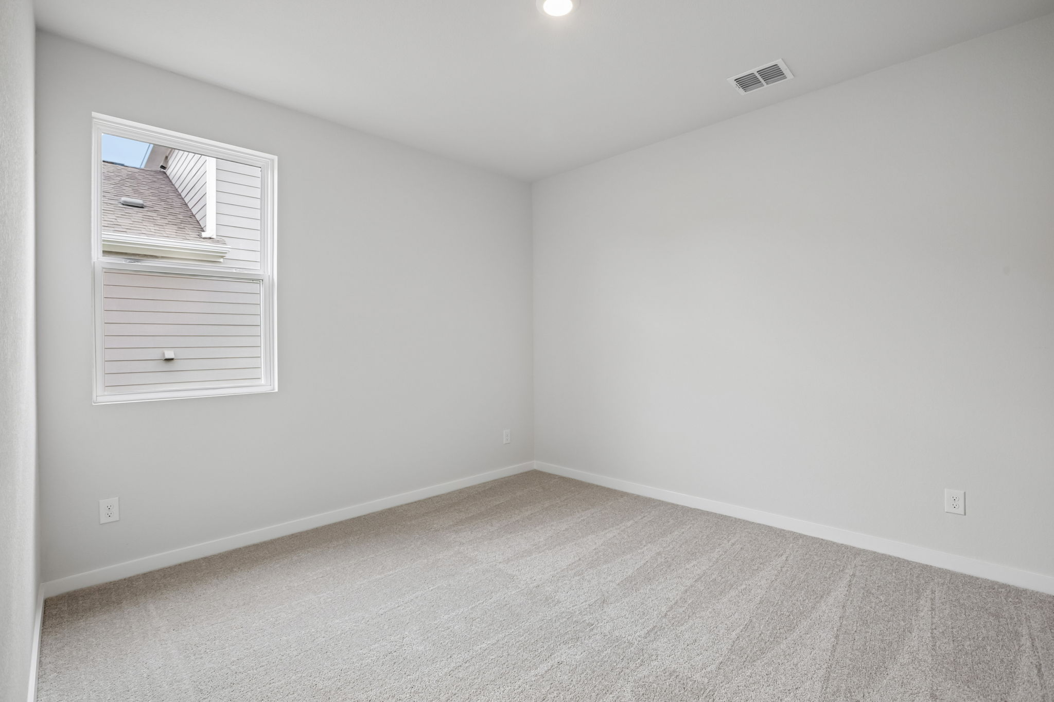 A room with a window and a door.