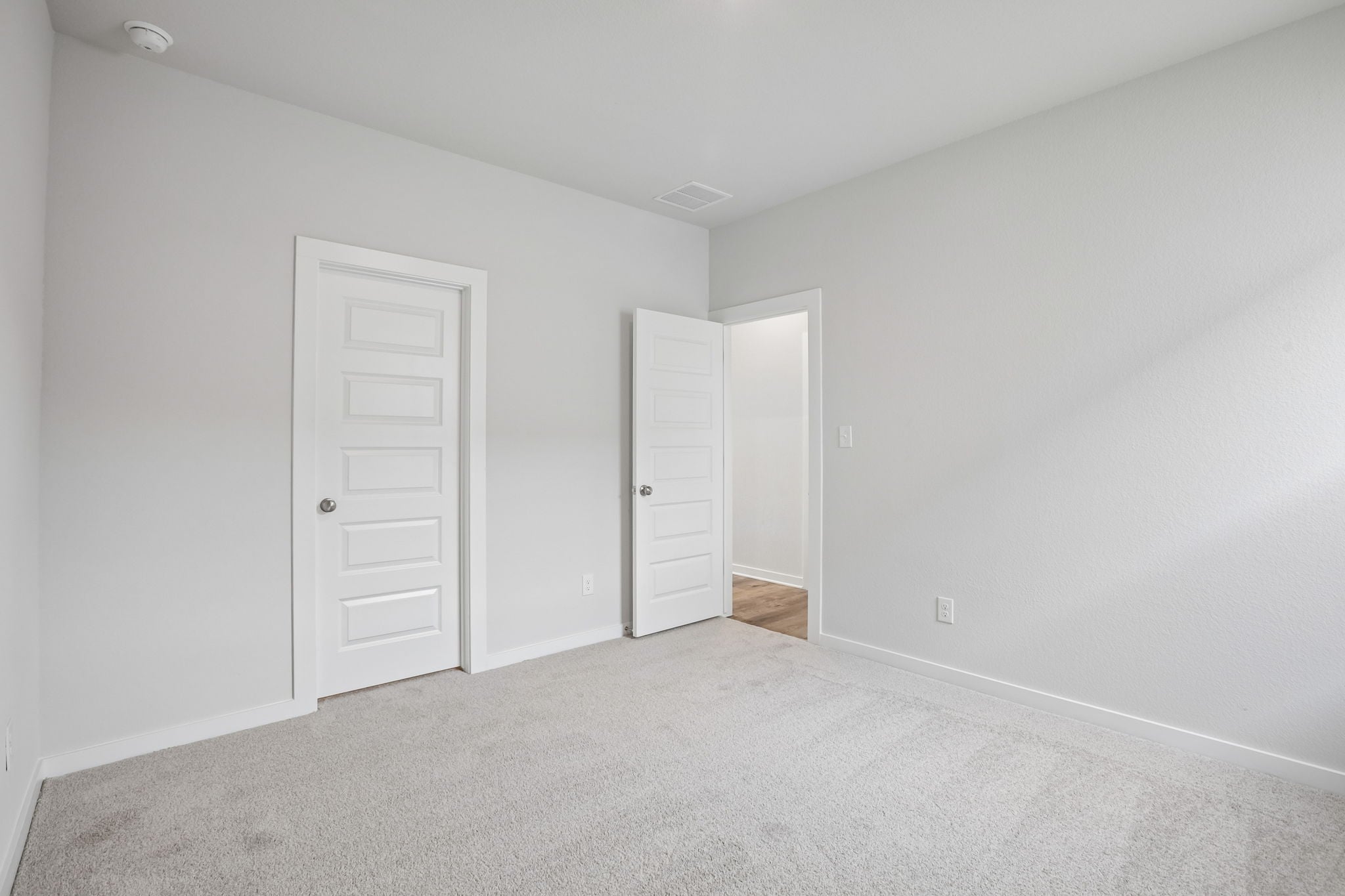 A room with white doors.