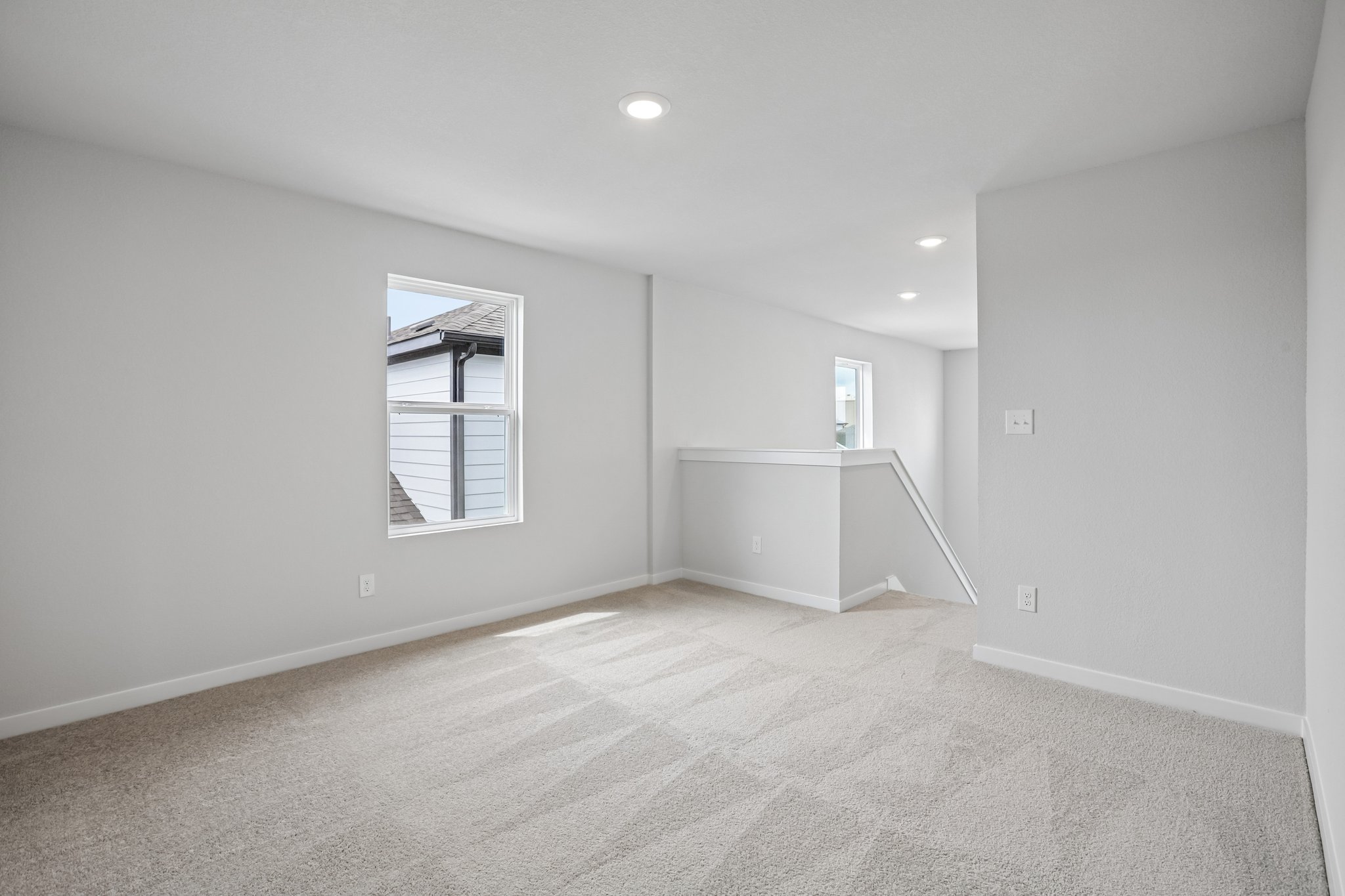 A room with a window and a door.