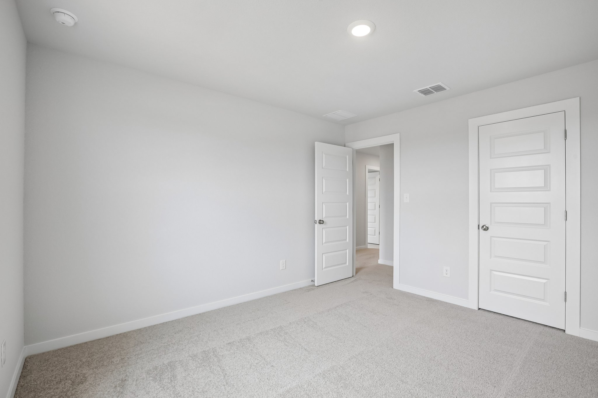 A room with white doors.