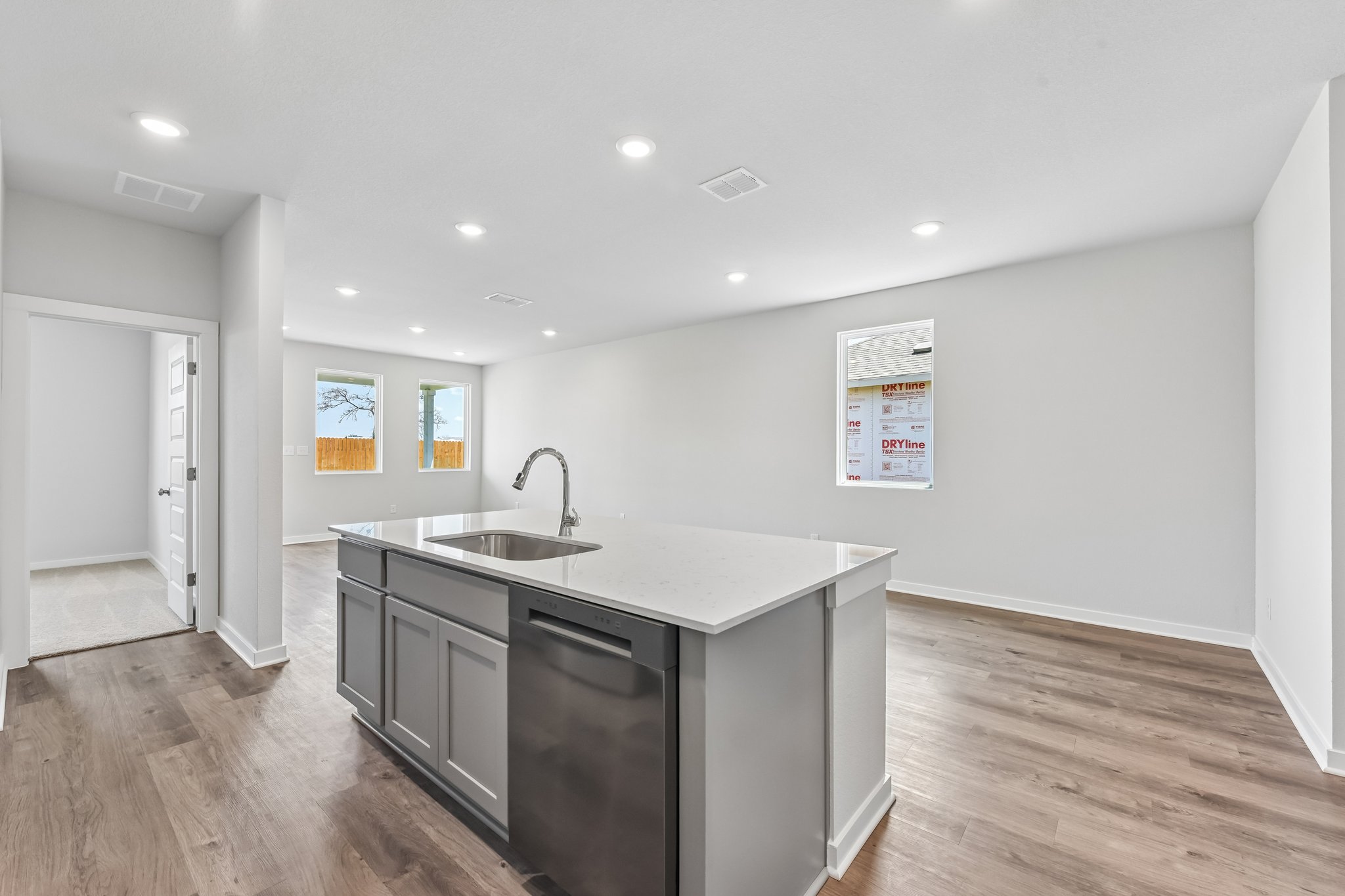 A kitchen with a sink and cabinets.