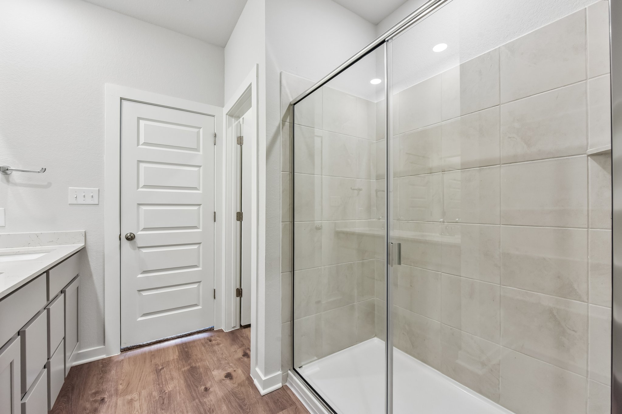A bathroom with a glass shower.