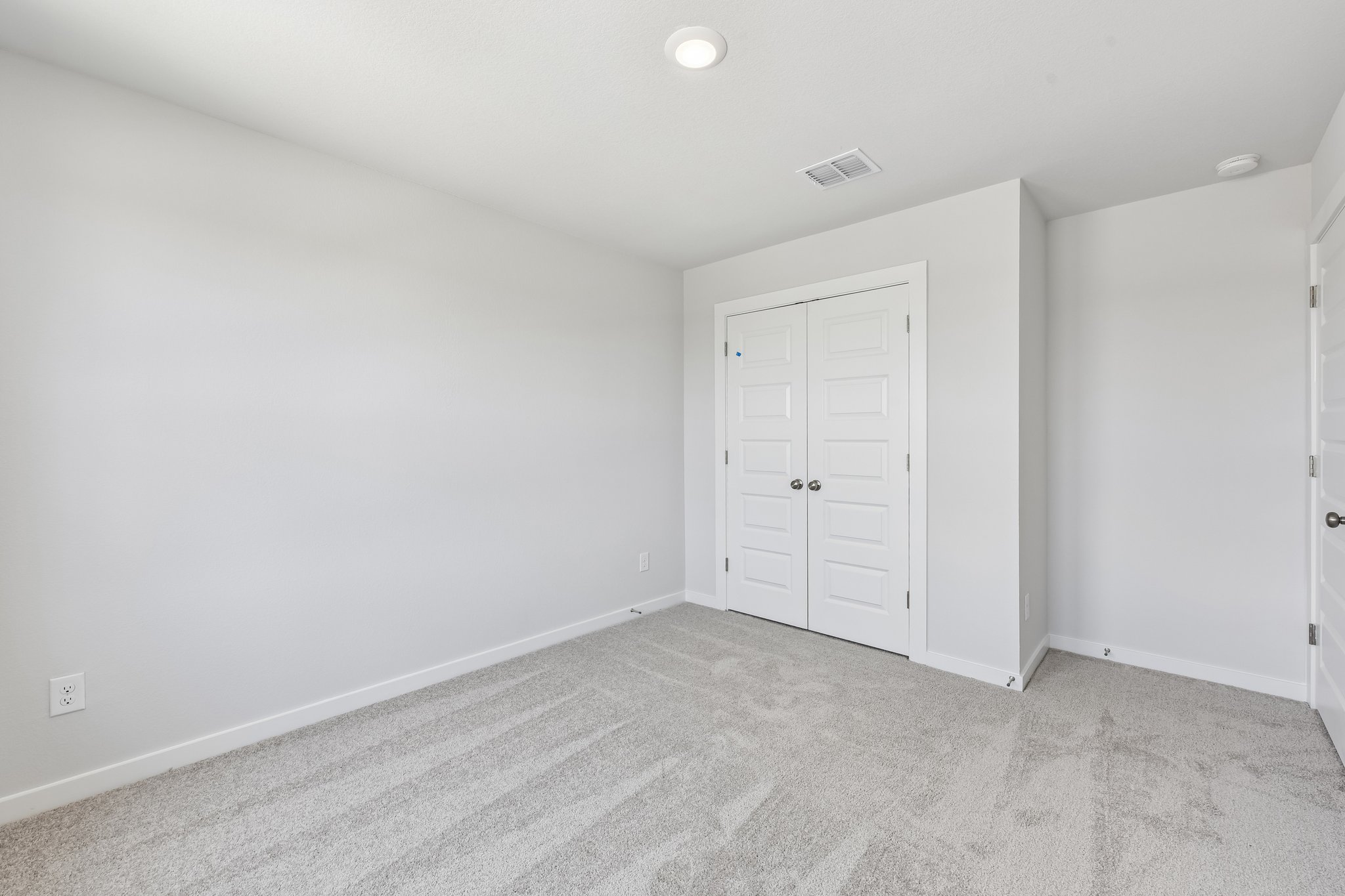 A room with white doors.