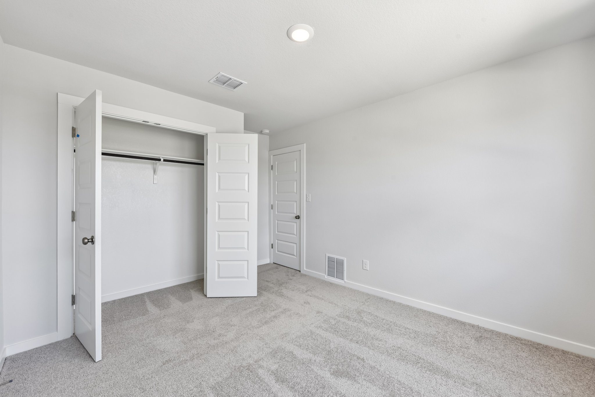 A room with white cabinets.
