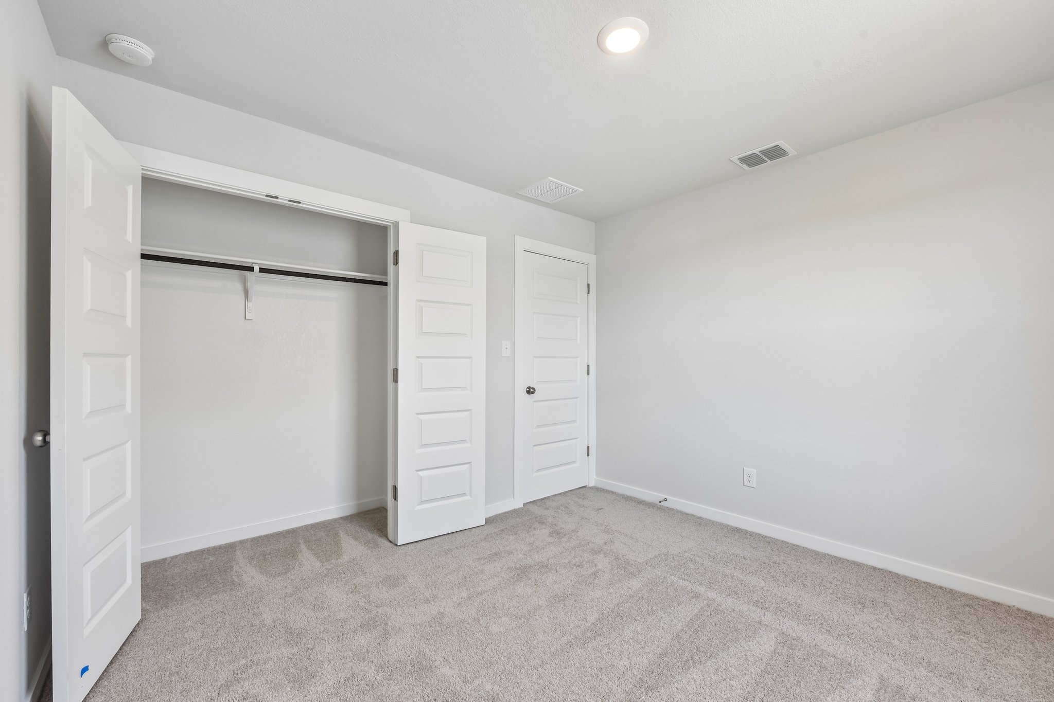 A room with white doors.