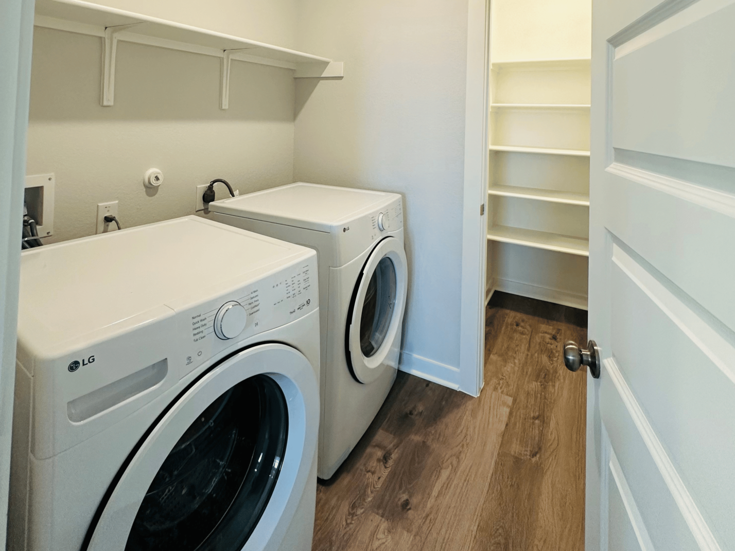 A white washing machine in a room.
