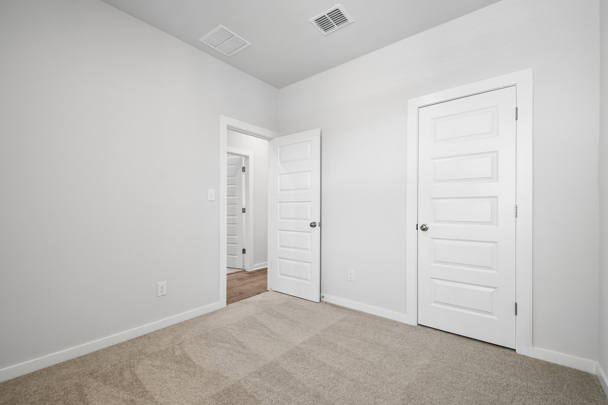 A room with white doors.