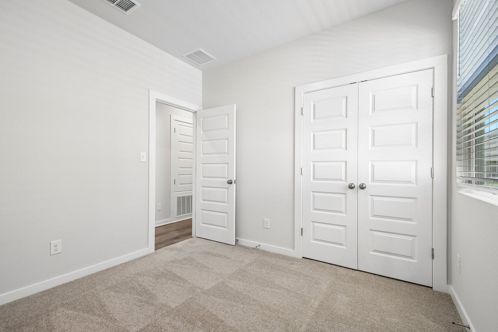 A room with white doors.
