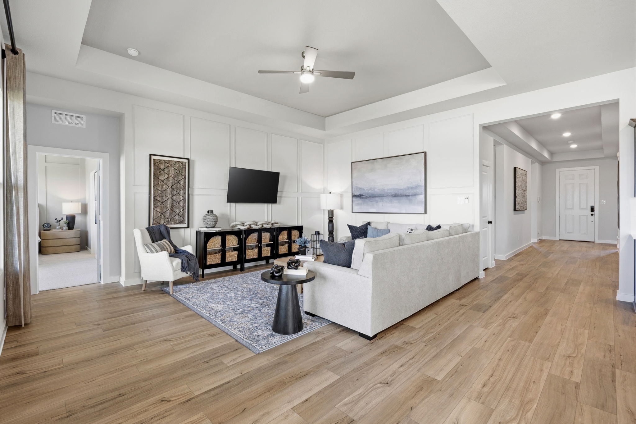 A living room with a wood floor.