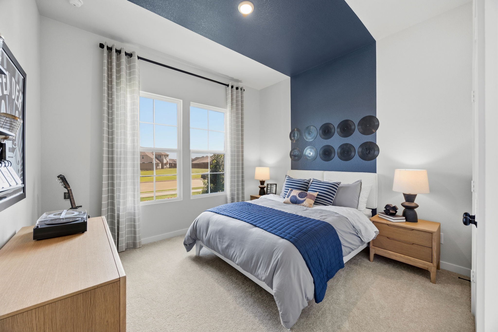 A bedroom with a bed and a window.