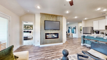 A living room with a tv and a couch.