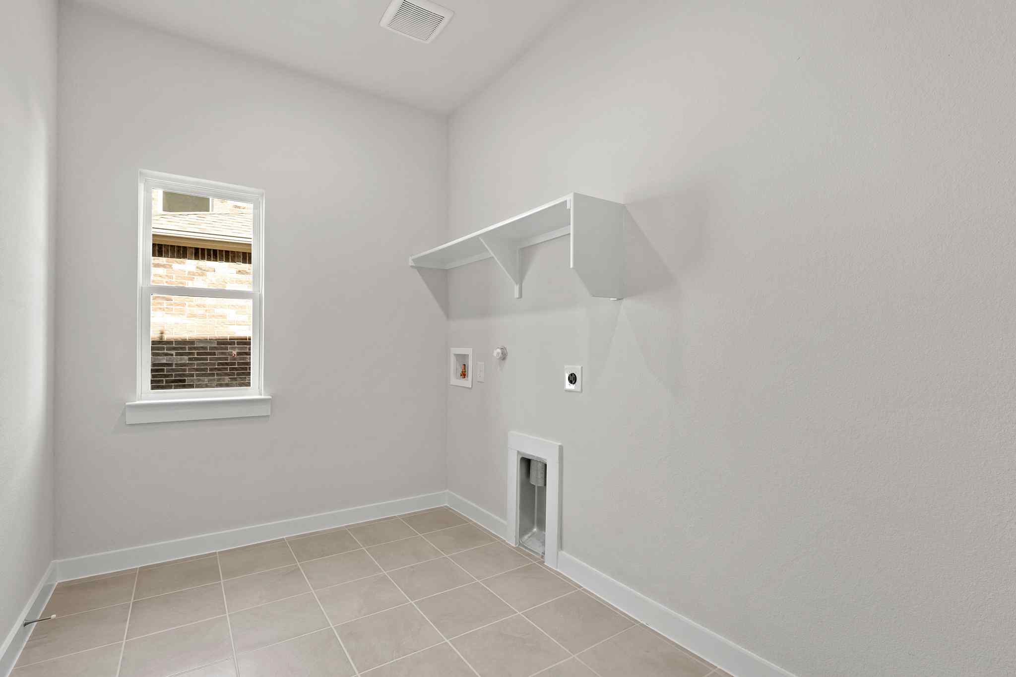 A white room with a window.