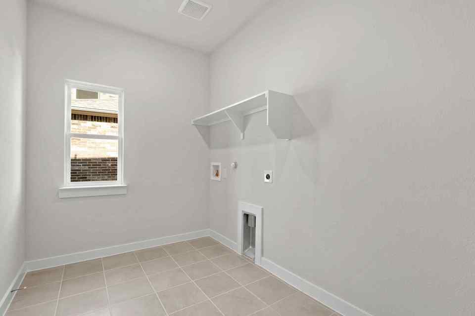 A white room with a window.