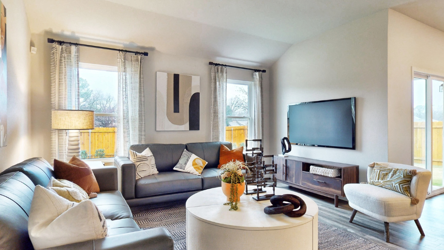 A living room with a tv and couches.