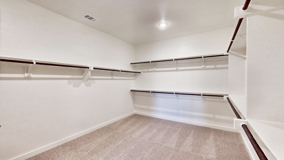 A white room with a staircase.