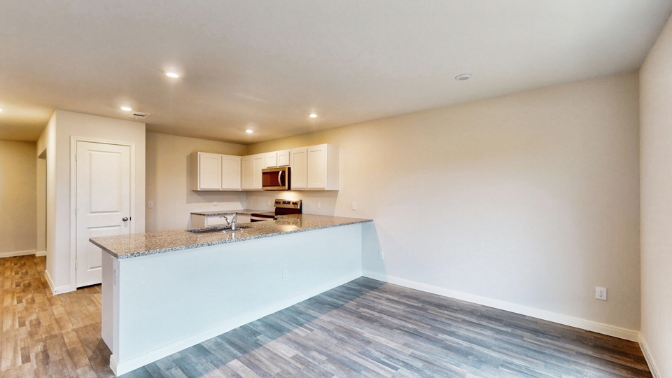 A kitchen with a large island.