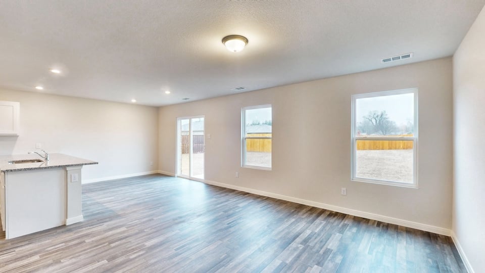 A large empty room with a large window.