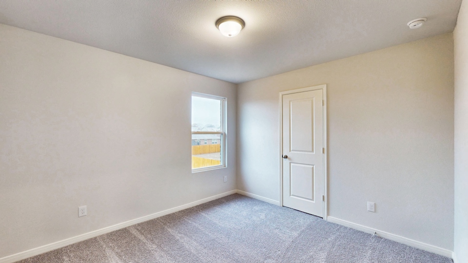 A room with a door and a window.