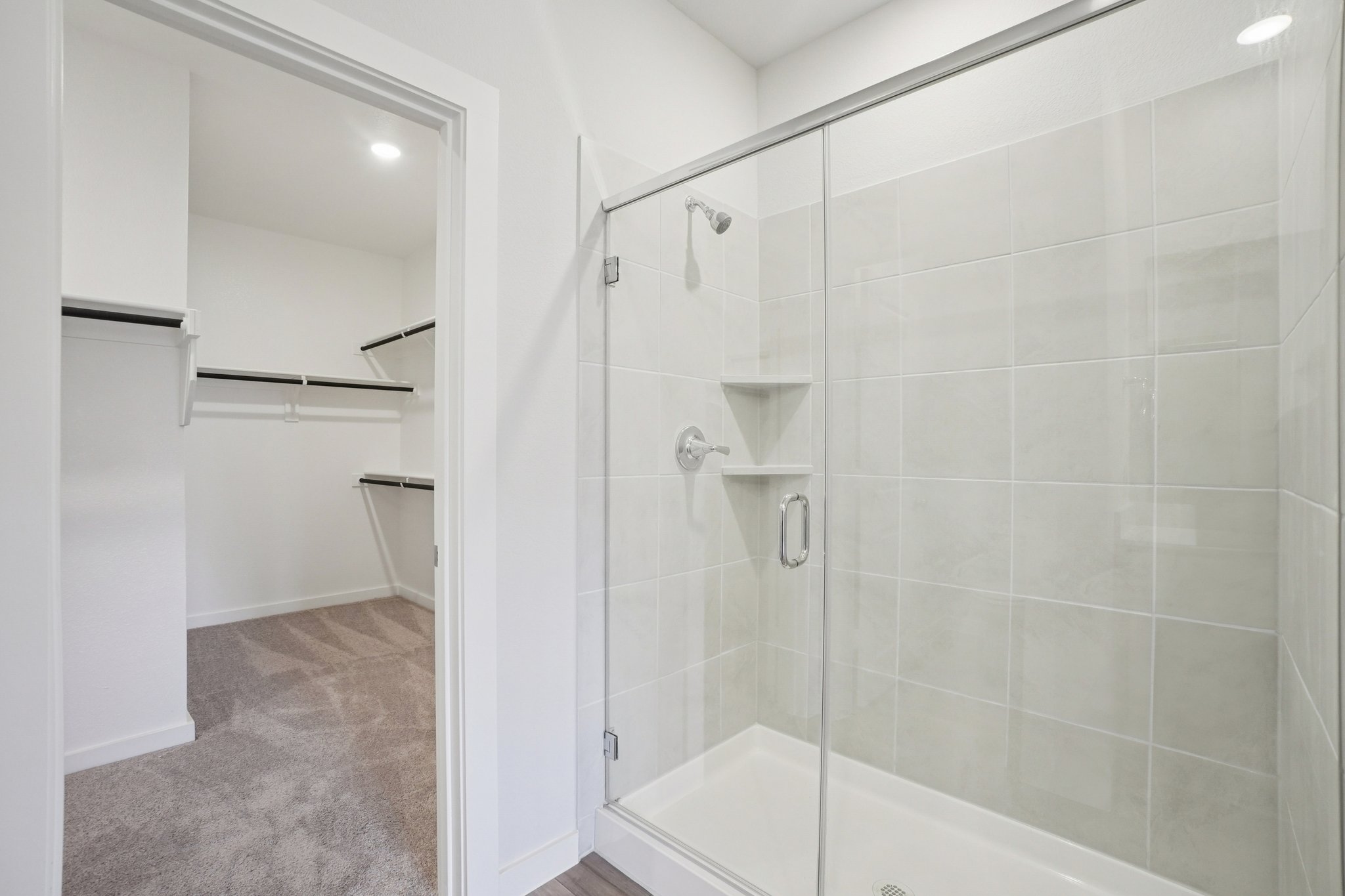A bathroom with a glass shower.