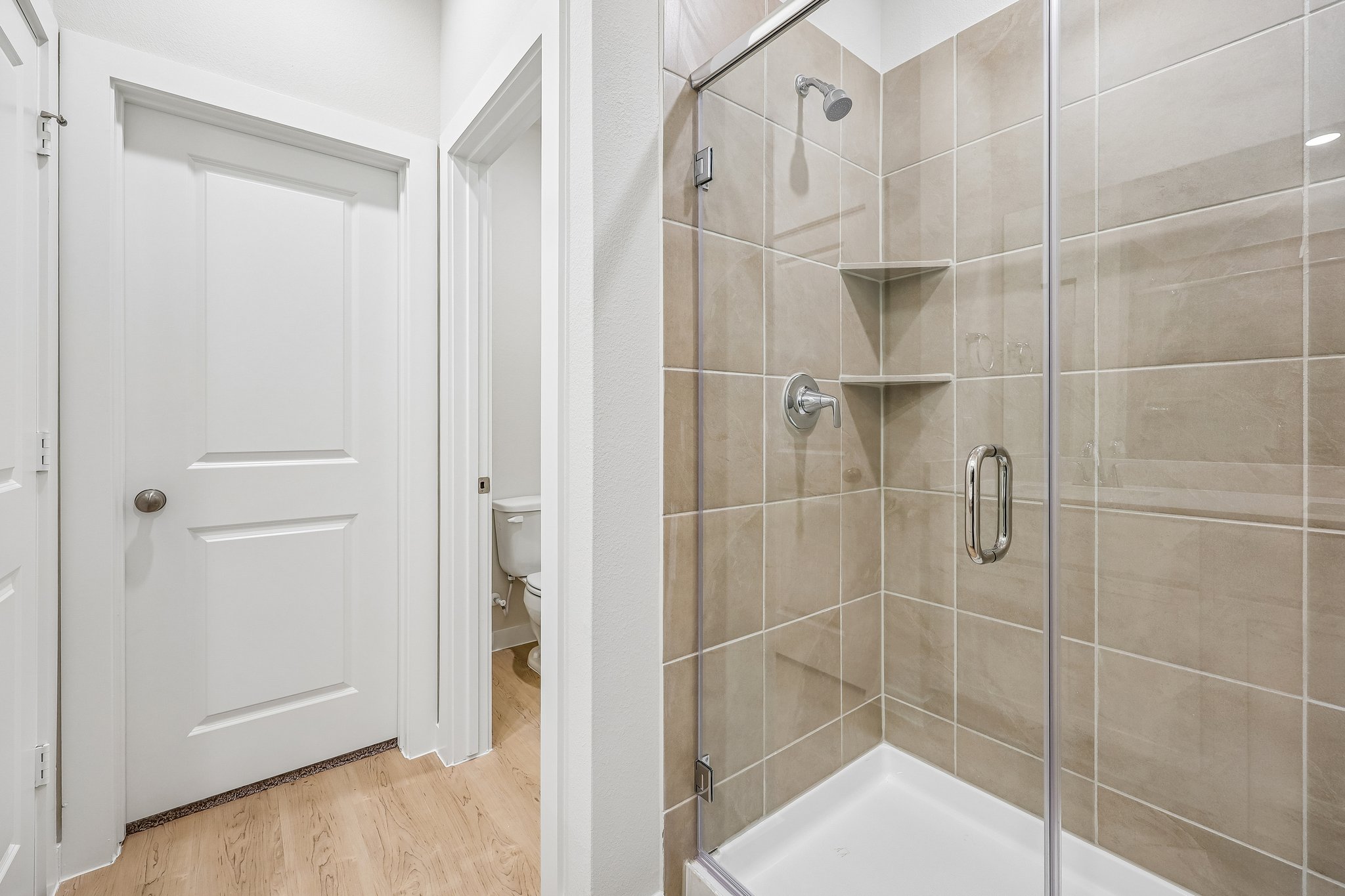 A bathroom with a glass shower.