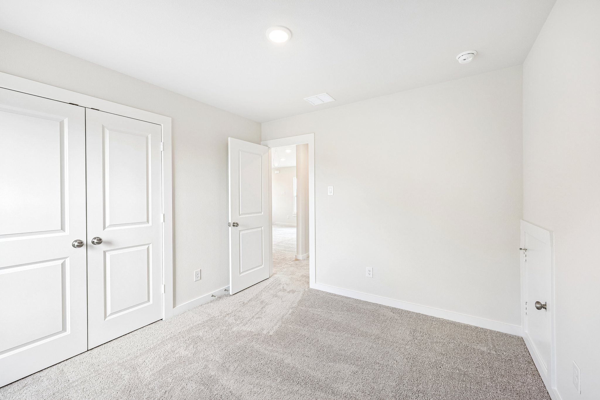 A room with white doors.