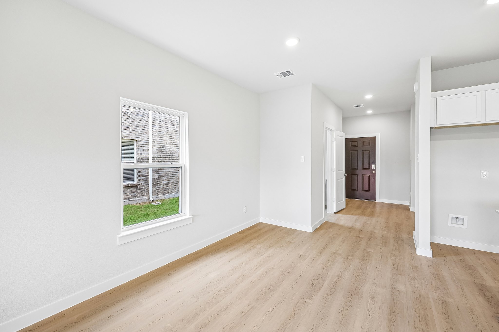 A room with a wood floor and a wood floor.